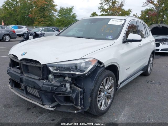 Photo 1 VIN: WBXHT3C32G5E56375 - BMW X1 