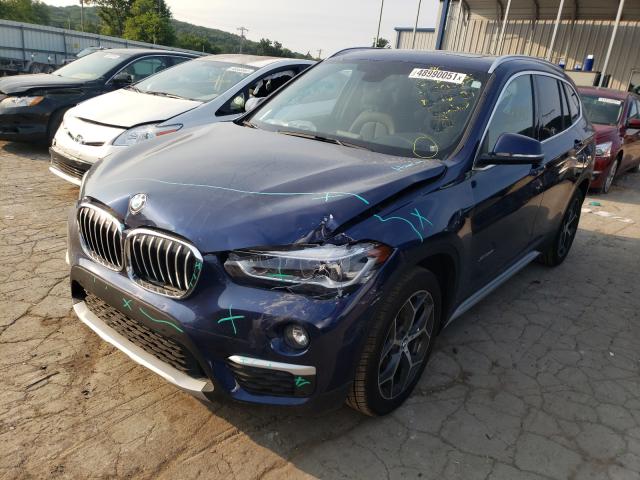 Photo 1 VIN: WBXHT3C32G5F64477 - BMW X1 