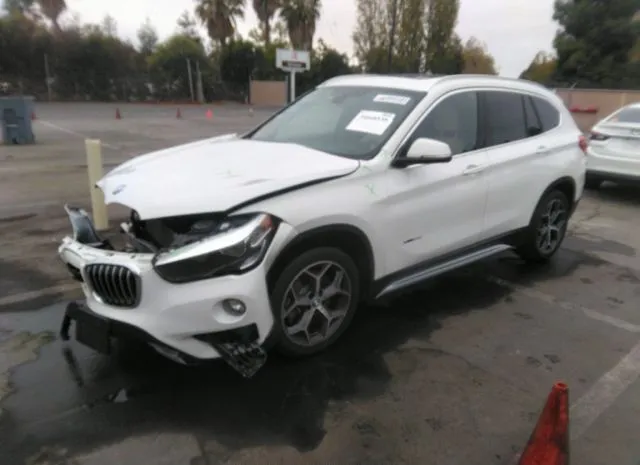 Photo 1 VIN: WBXHT3C32H5F78090 - BMW X1 