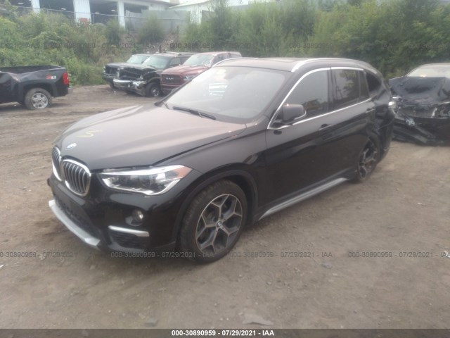 Photo 1 VIN: WBXHT3C32J5L26973 - BMW X1 