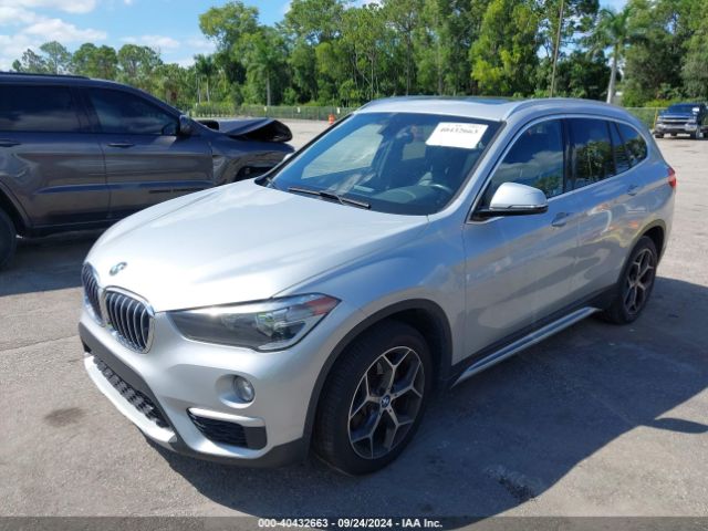 Photo 1 VIN: WBXHT3C32J5L31901 - BMW X1 