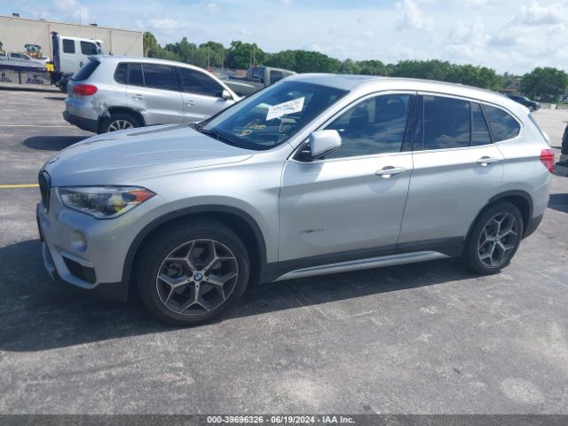 Photo 1 VIN: WBXHT3C33G5E48205 - BMW X1 