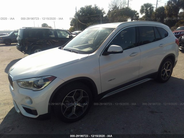 Photo 1 VIN: WBXHT3C33G5E48723 - BMW X1 