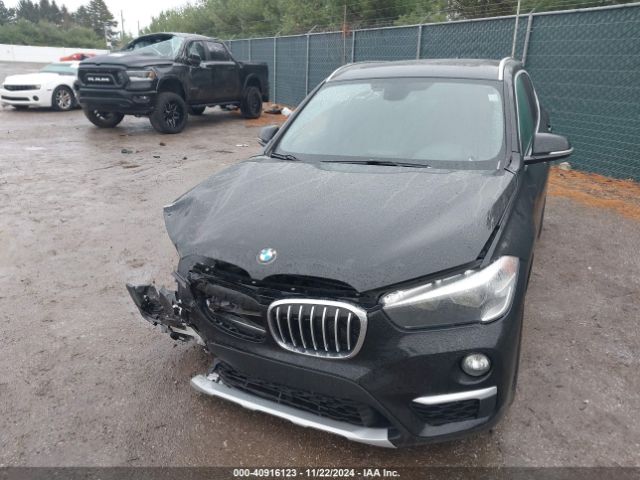 Photo 1 VIN: WBXHT3C33G5F64004 - BMW X1 