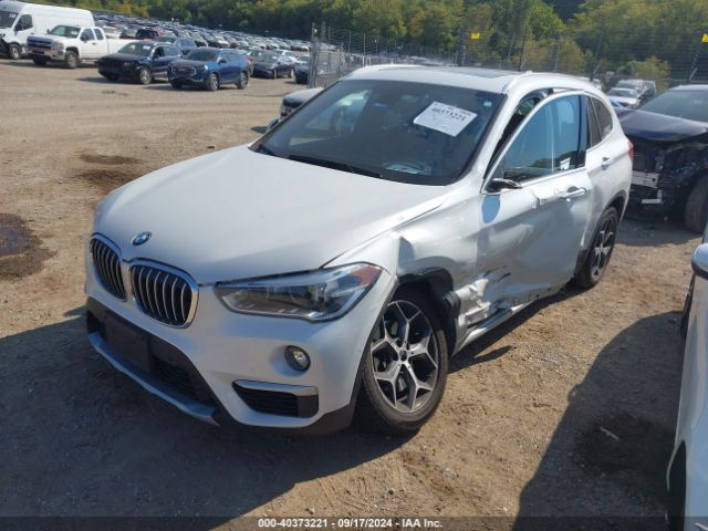 Photo 1 VIN: WBXHT3C33GP883582 - BMW X1 