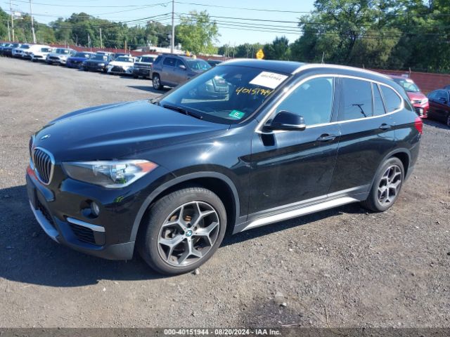 Photo 1 VIN: WBXHT3C33J5L33737 - BMW X1 