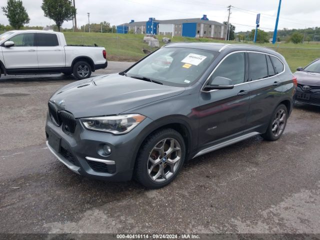 Photo 1 VIN: WBXHT3C34G5E49914 - BMW X1 