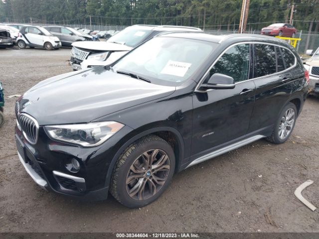 Photo 1 VIN: WBXHT3C34G5E50674 - BMW X1 