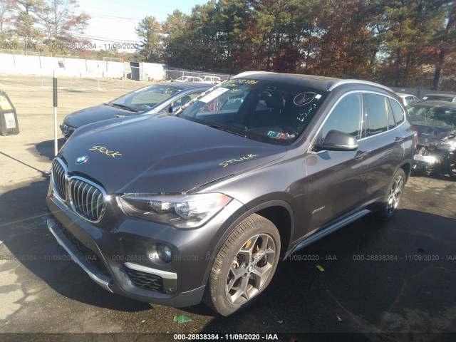 Photo 1 VIN: WBXHT3C34G5E55034 - BMW X1 