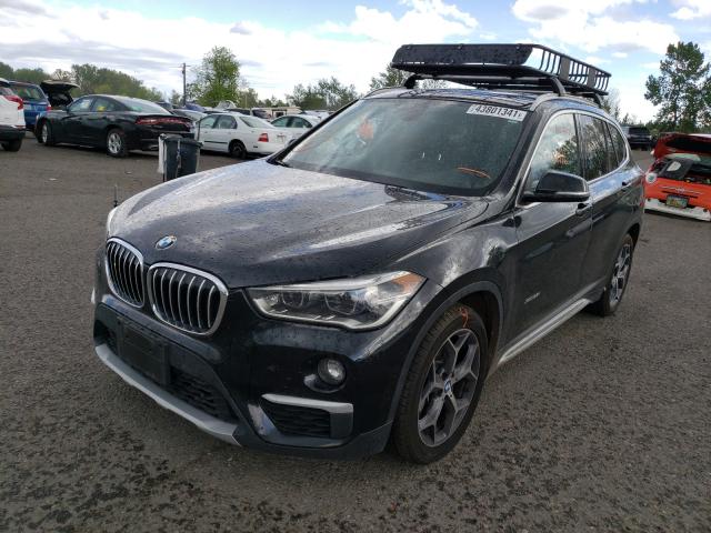 Photo 1 VIN: WBXHT3C34G5E55406 - BMW X1 