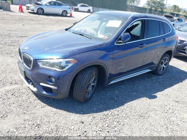 Photo 1 VIN: WBXHT3C34H5F74056 - BMW X1 