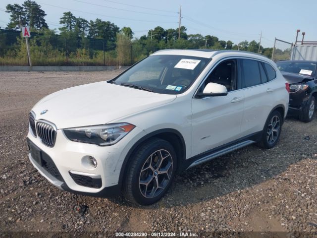 Photo 1 VIN: WBXHT3C34J5K29273 - BMW X1 