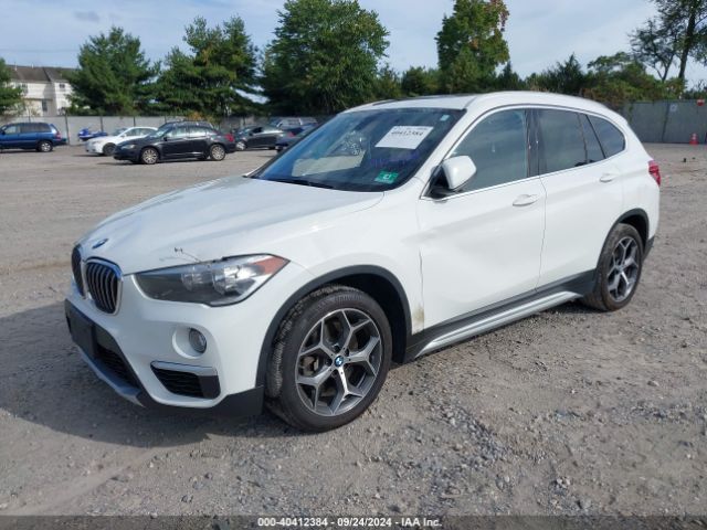 Photo 1 VIN: WBXHT3C34J5L28952 - BMW X1 