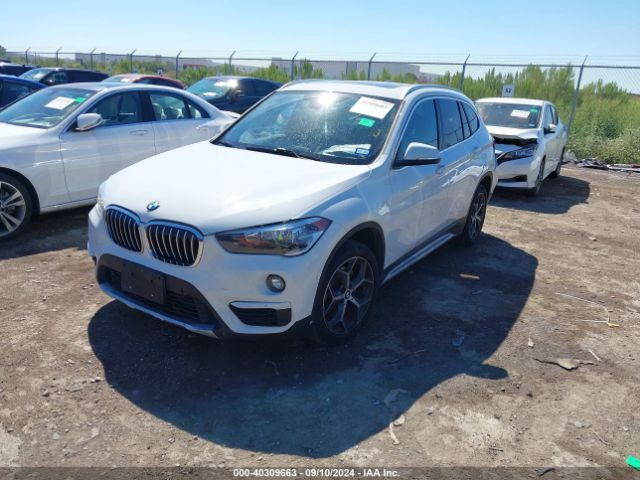 Photo 1 VIN: WBXHT3C34J5L31060 - BMW X1 