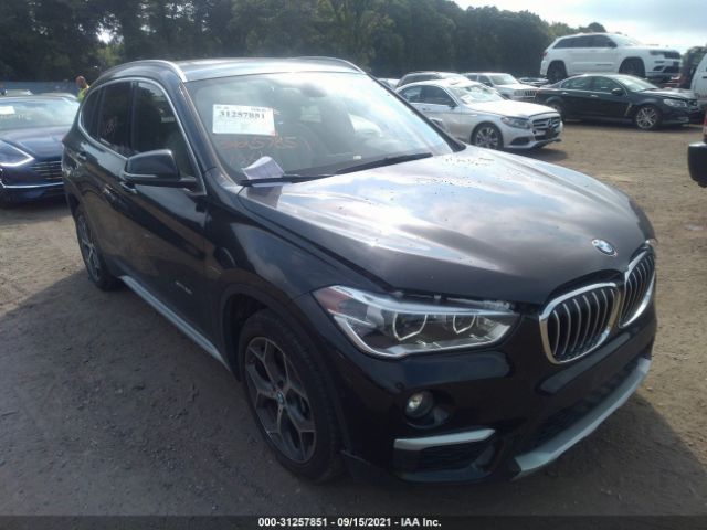 Photo 0 VIN: WBXHT3C35G5E50974 - BMW X1 