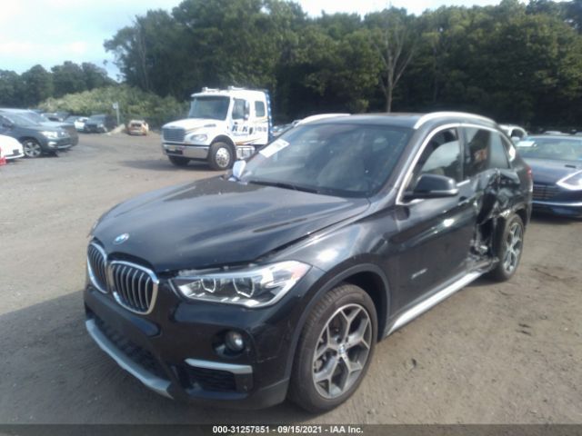 Photo 1 VIN: WBXHT3C35G5E50974 - BMW X1 