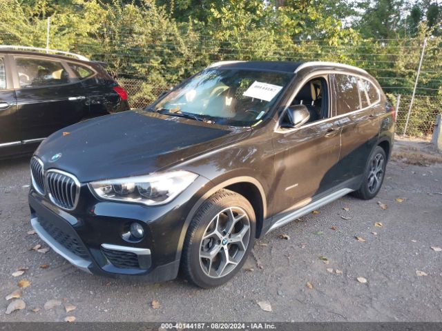 Photo 1 VIN: WBXHT3C35J5K22204 - BMW X1 