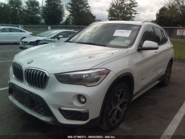 Photo 1 VIN: WBXHT3C35J5K29492 - BMW X1 