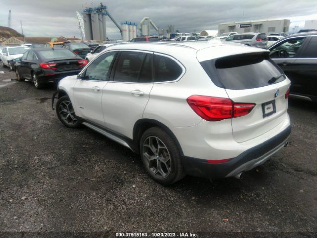 Photo 2 VIN: WBXHT3C36H5F77007 - BMW X1 