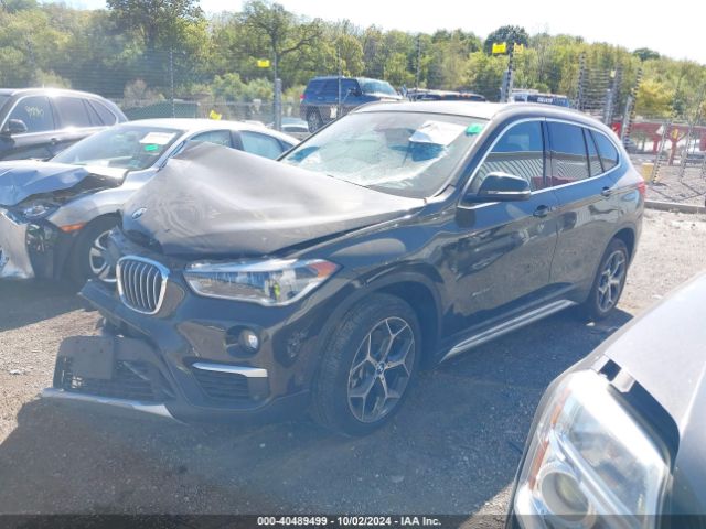 Photo 1 VIN: WBXHT3C36H5F81705 - BMW X1 