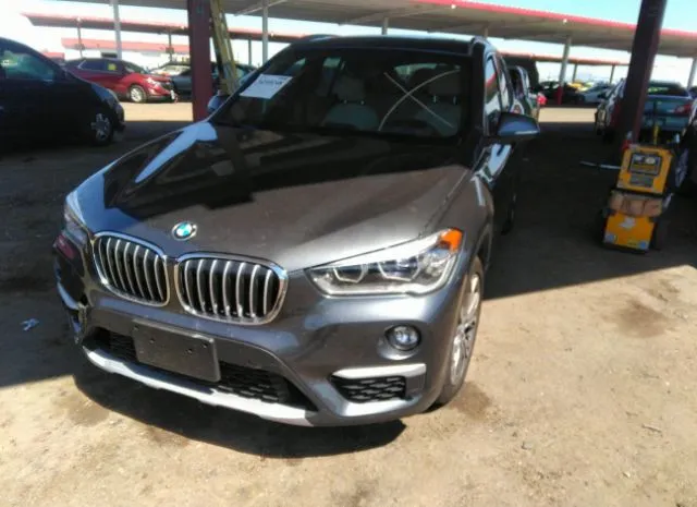 Photo 1 VIN: WBXHT3C38G5E50189 - BMW X1 