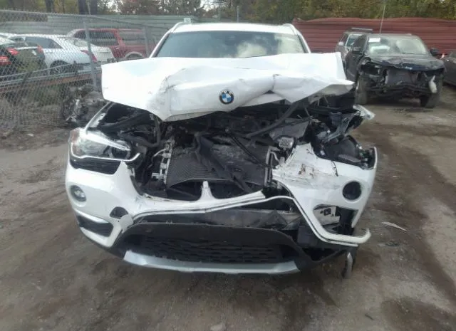 Photo 5 VIN: WBXHT3C38J5K32113 - BMW X1 