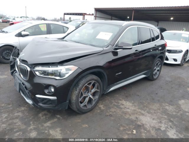 Photo 1 VIN: WBXHT3C39G5F64623 - BMW X1 