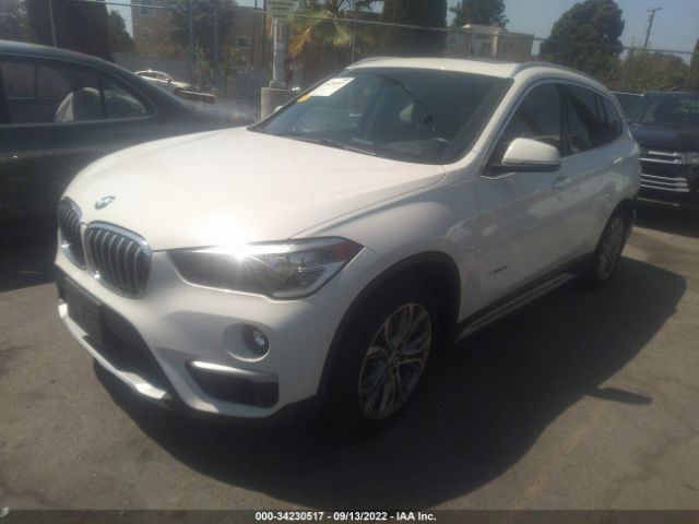 Photo 1 VIN: WBXHT3C39G5F67070 - BMW X1 