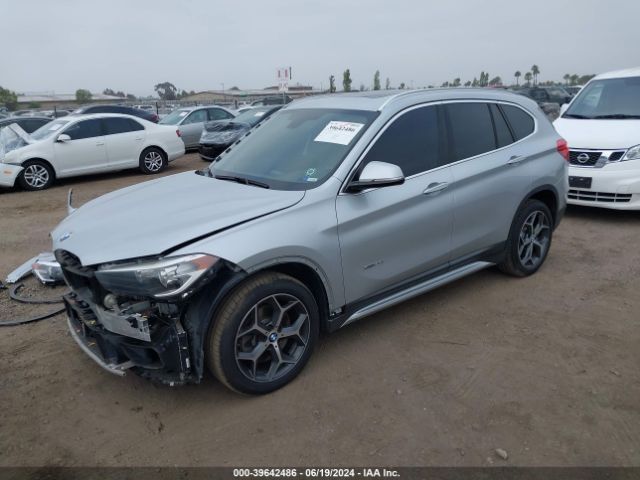 Photo 1 VIN: WBXHT3C39GP889581 - BMW X1 