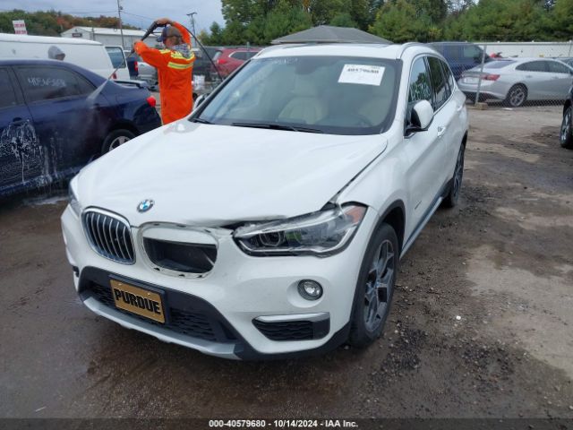 Photo 1 VIN: WBXHT3C3XG5E48220 - BMW X1 