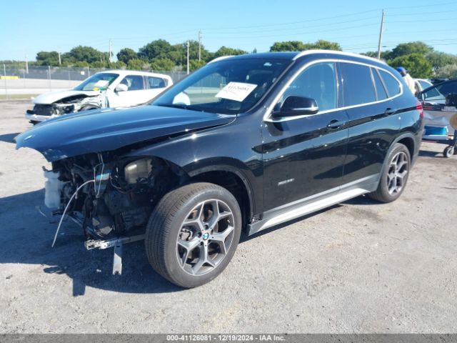 Photo 1 VIN: WBXHT3C3XGP881828 - BMW X1 