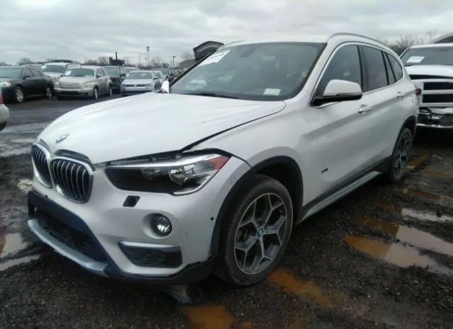 Photo 1 VIN: WBXHT3C3XH5F77267 - BMW X1 