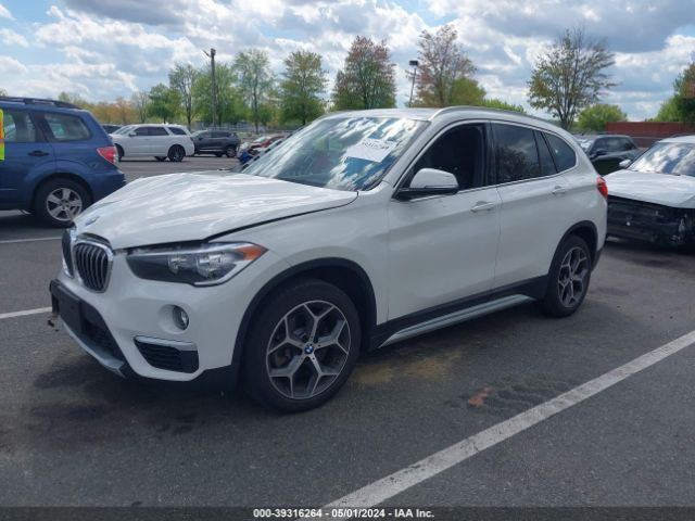 Photo 1 VIN: WBXHT3C51K3H35287 - BMW X1 