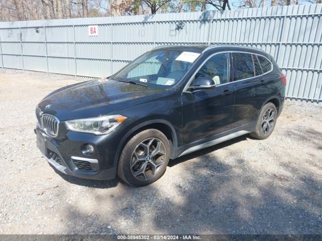 Photo 1 VIN: WBXHT3C53K5L36205 - BMW X1 