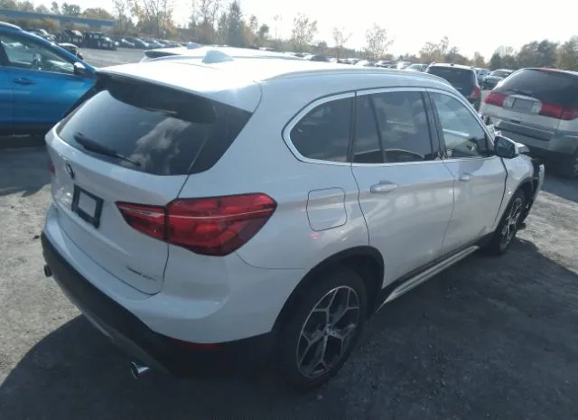 Photo 3 VIN: WBXHT3C54K5N38700 - BMW X1 