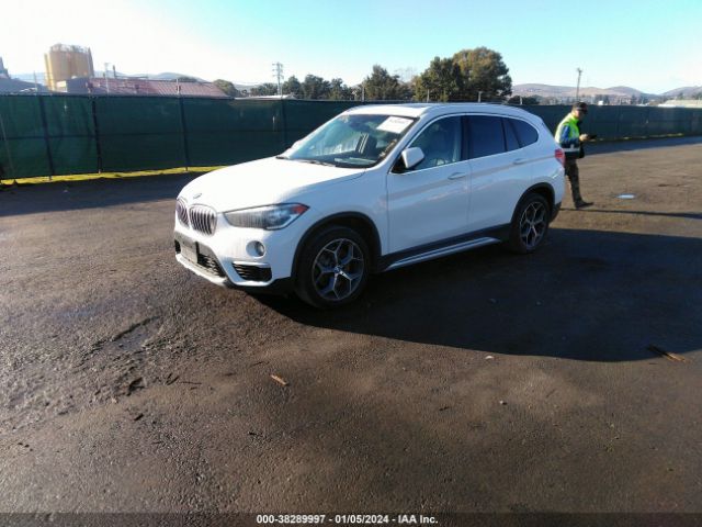 Photo 1 VIN: WBXHT3C56K3H34085 - BMW X1 