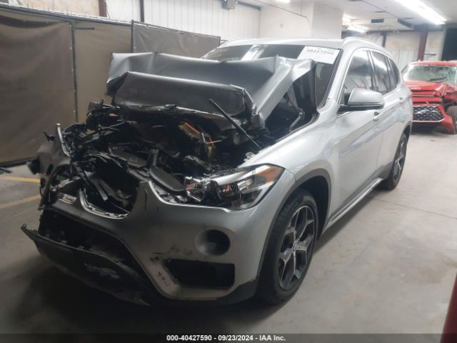 Photo 1 VIN: WBXHT3C56K3H34216 - BMW X1 