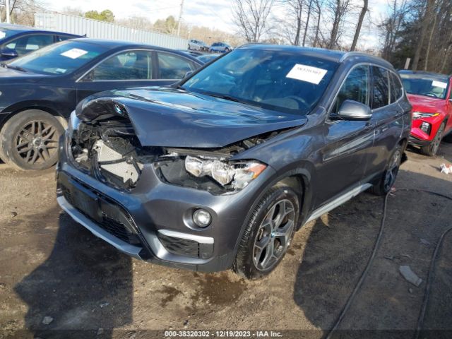 Photo 1 VIN: WBXHT3C57K5L91403 - BMW X1 