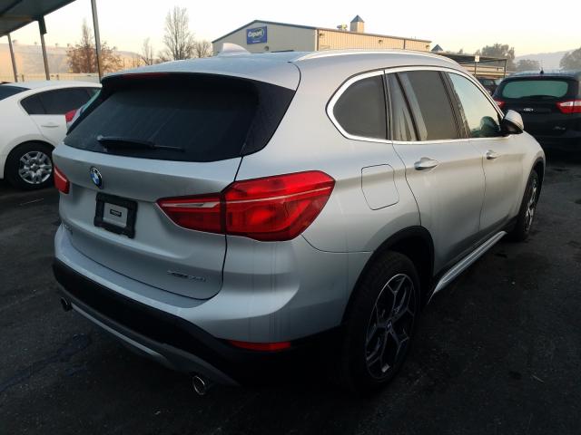 Photo 3 VIN: WBXHT3C58K3H34203 - BMW X1 