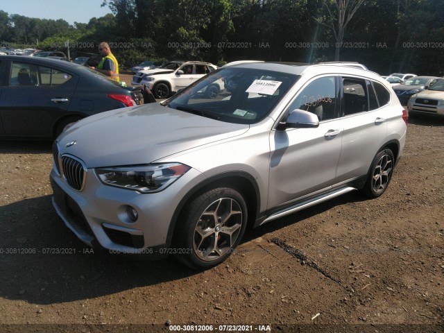 Photo 1 VIN: WBXHT3C5XK5L89306 - BMW X1 