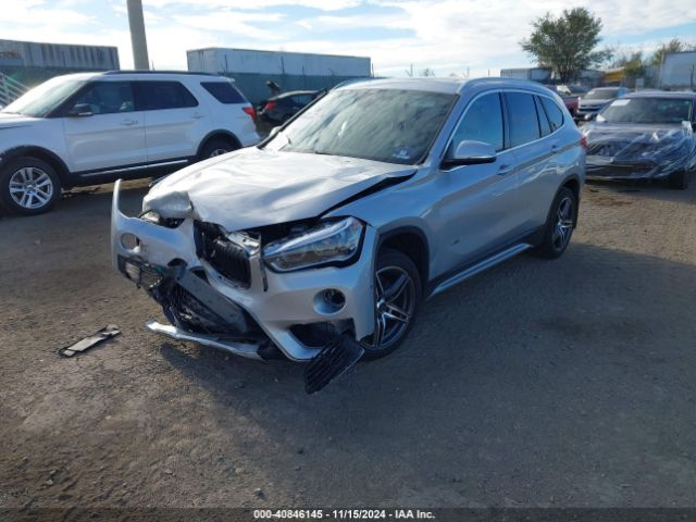 Photo 1 VIN: WBXHT3Z31H4A57696 - BMW X1 