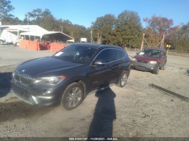 Photo 1 VIN: WBXHT3Z32G4A49492 - BMW X1 