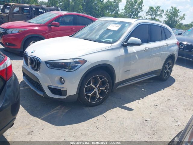 Photo 1 VIN: WBXHT3Z33G4A47590 - BMW X1 