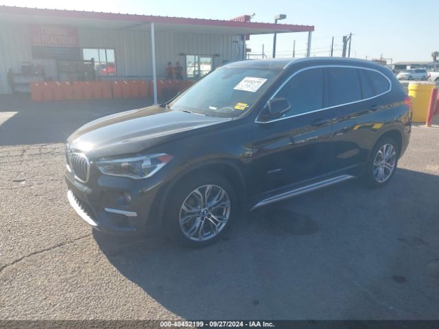 Photo 1 VIN: WBXHT3Z34G4A49185 - BMW X1 