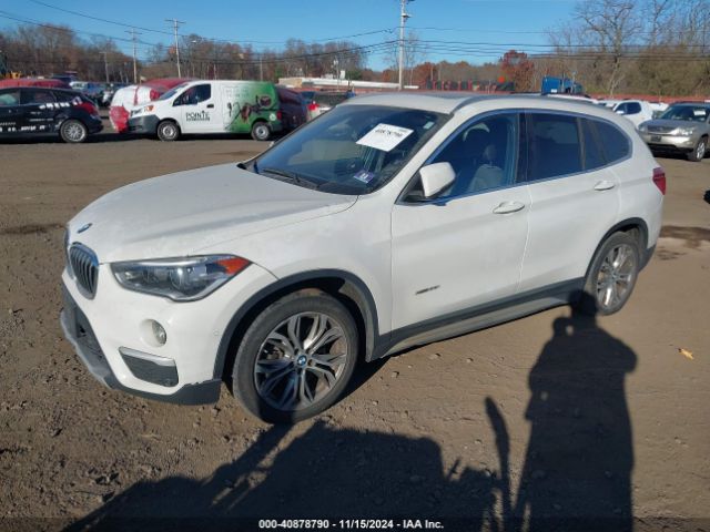 Photo 1 VIN: WBXHT3Z34G4A50675 - BMW X1 