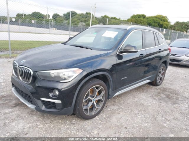 Photo 1 VIN: WBXHT3Z34J4A66804 - BMW X1 