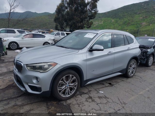 Photo 1 VIN: WBXHT3Z36G4A47857 - BMW X1 