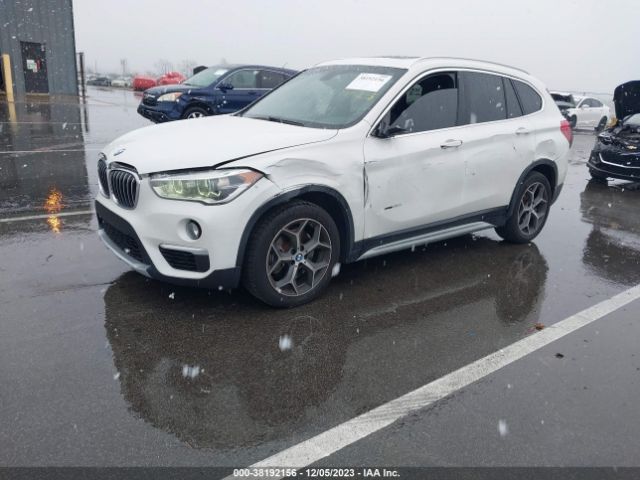 Photo 1 VIN: WBXHT3Z38G4A49156 - BMW X1 