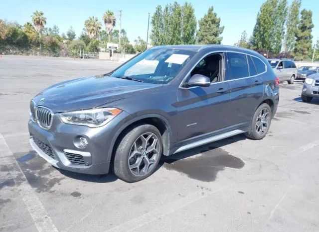 Photo 1 VIN: WBXHT3Z39G4A50140 - BMW X1 