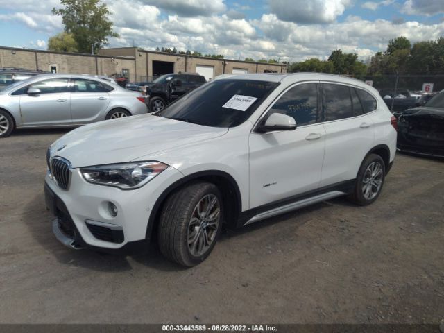 Photo 1 VIN: WBXHT3Z39H4A52293 - BMW X1 